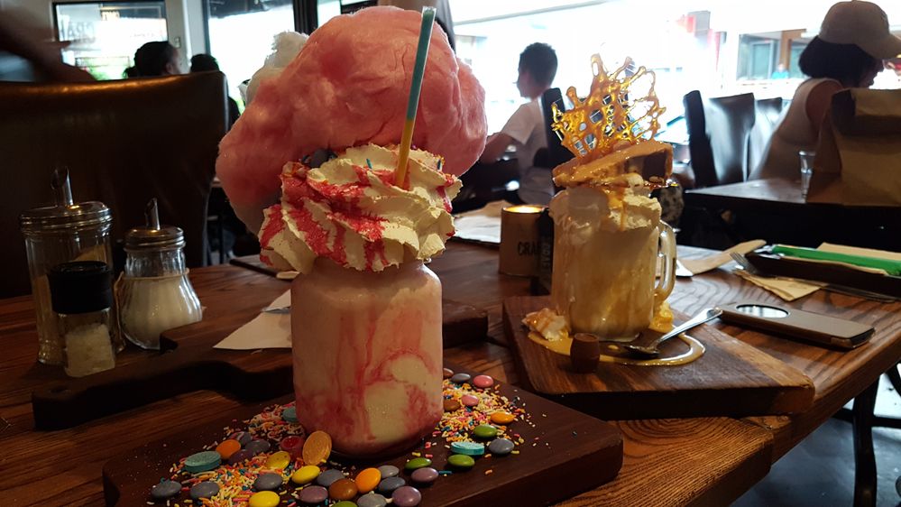 Caption: The Candy Feast "FreakShake" with candy floss and Salted Caramel Delight with salted caramel disk. ( Local Guide Andrew Milne)