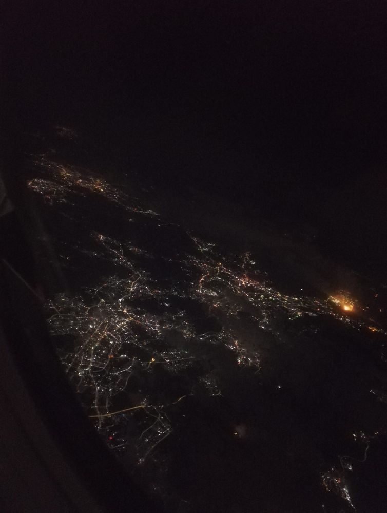 Caption: A night photo of Hong Kong from an airplane. (Local Guide @TsekoV)