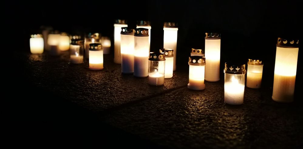 Caption: Candles being lit on Christmas eve at graveyards, Espoo, Finland. (Local Guide MrUkko.)