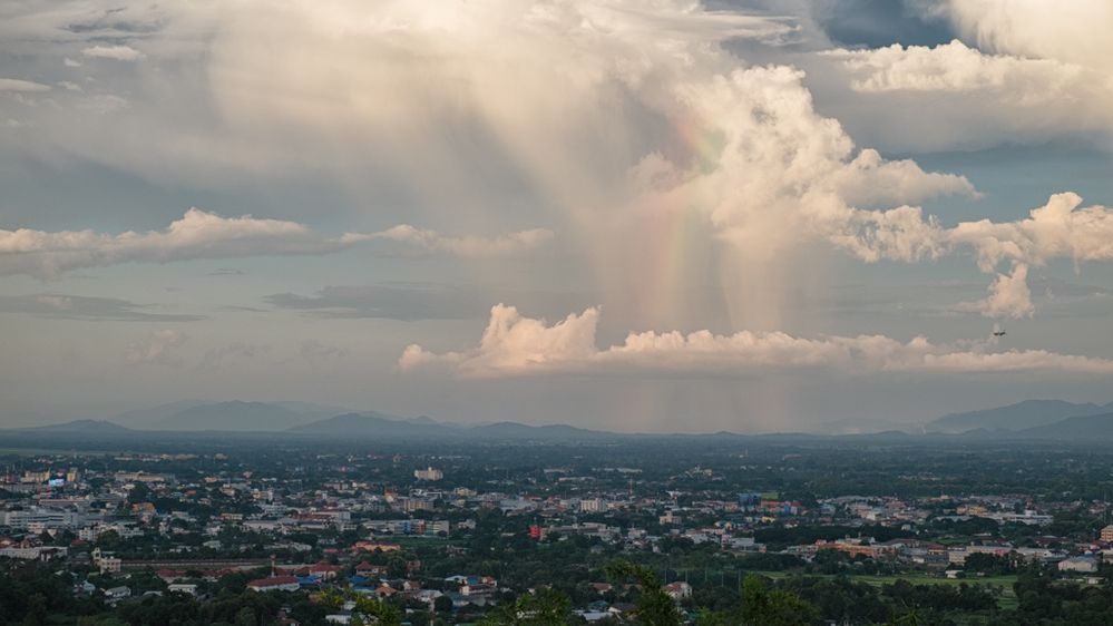 Showers, clouds, a rainbow, Chiang Rai cityscape, both airports, all in one photo