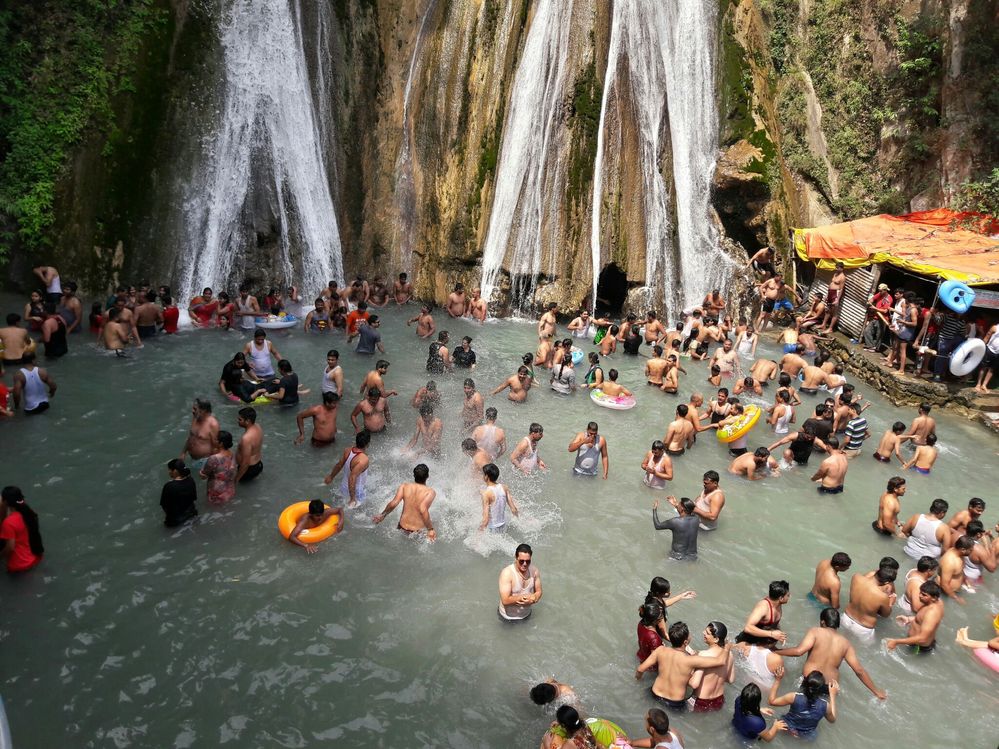 Visitors enjoying bath in Kempty Falls, Mussoorie.