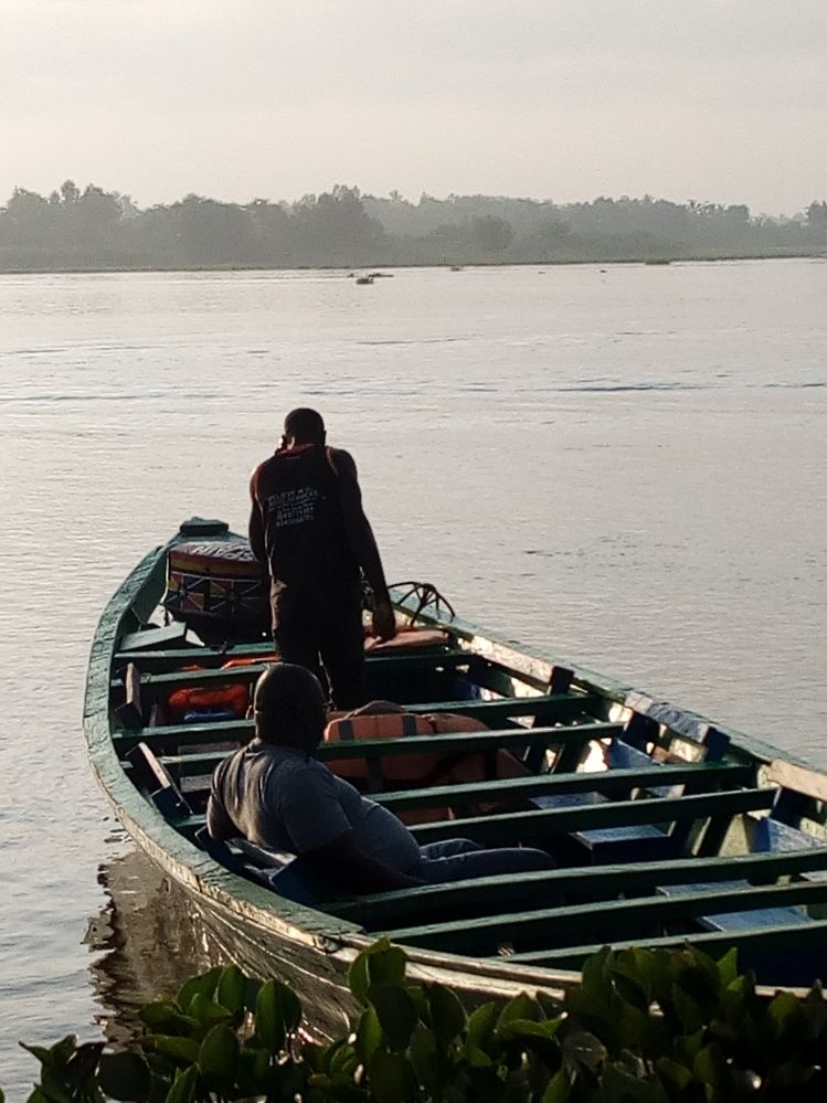 A man ready to go for a ride on the Volta lake.