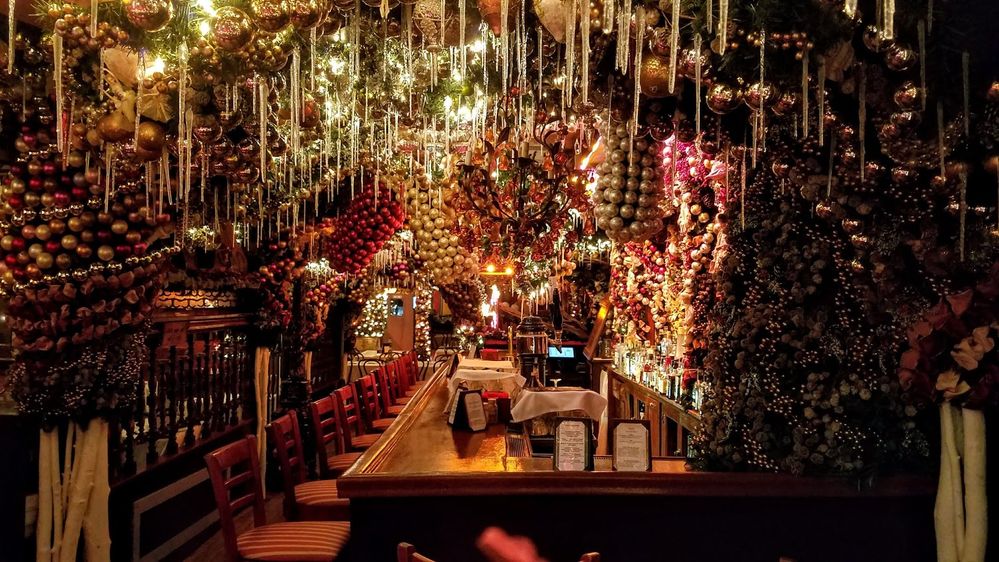 Caption: A photo of the inside of Rolf’s, a German bar and restaurant in New York City, during Christmas time, showing the extensive Christmas decorations hanging from the ceilings and walls. (Local Guide T Szawkalo)