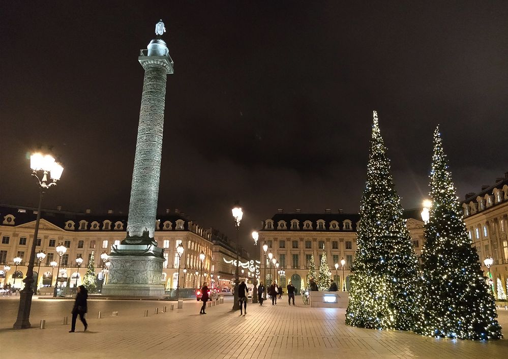 Caption: A photo of the Vendôme Column and christmas trees lit with holiday lights in Place Vendôme in Paris, France. (Local Guide Guide Garry McGibbon)
