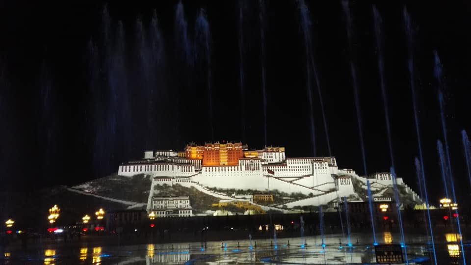 Caption: A night photo of the Potala Palace and a fountain in front of it. (Local Guide @TsekoV)