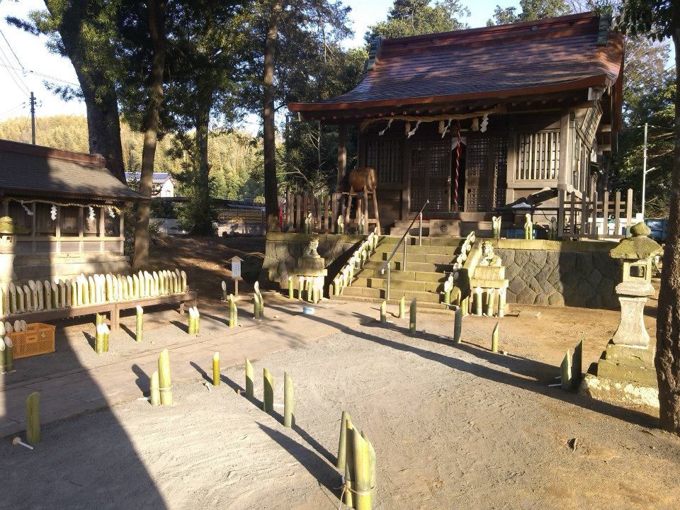 Caption: A photo of the Tenchi shrine's main building at sunset, with many bamboo lanterns placed on the ground in front of it in Kannami, Japan. (Local Guide @DeniGu)