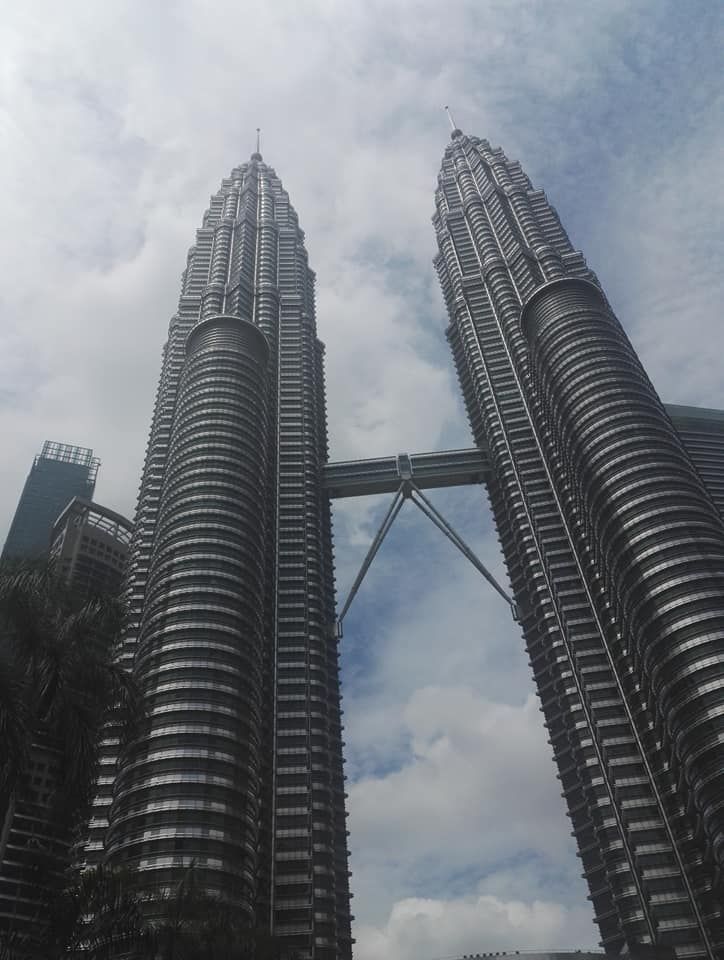 Caption: A photo of the Petronas Twin Tower in Kuala Lumpur with cloudy sky at the background. (Local Guide @TsekoV)