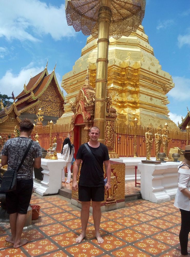 Caption: A photo of me posing in front of the Thailand's most famous temple - Doi Suthep in Chiang Mai. (Local Guide @TsekoV)