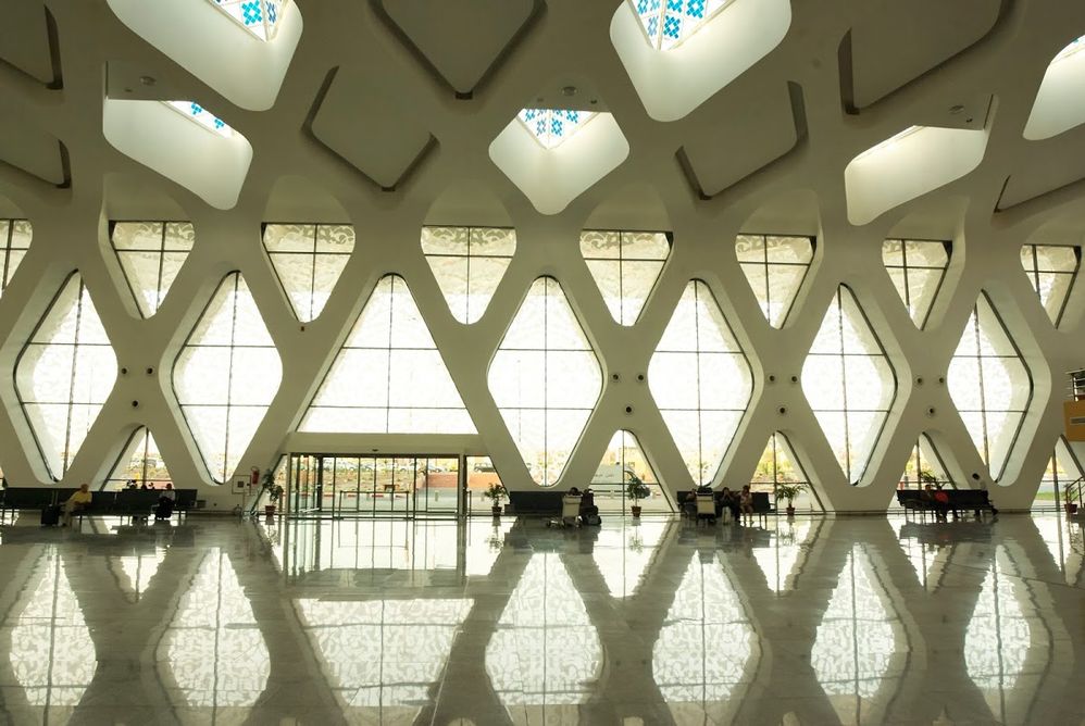 Caption: An interior photo of the entrance and wall of windows at Marrakech Menara Airport in Marrakech, Morocco. (Local Guide Chi Lam)