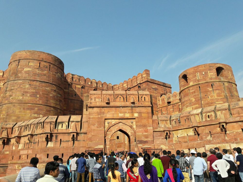 Caption: Visitors going inside Agra Fort through main gate.