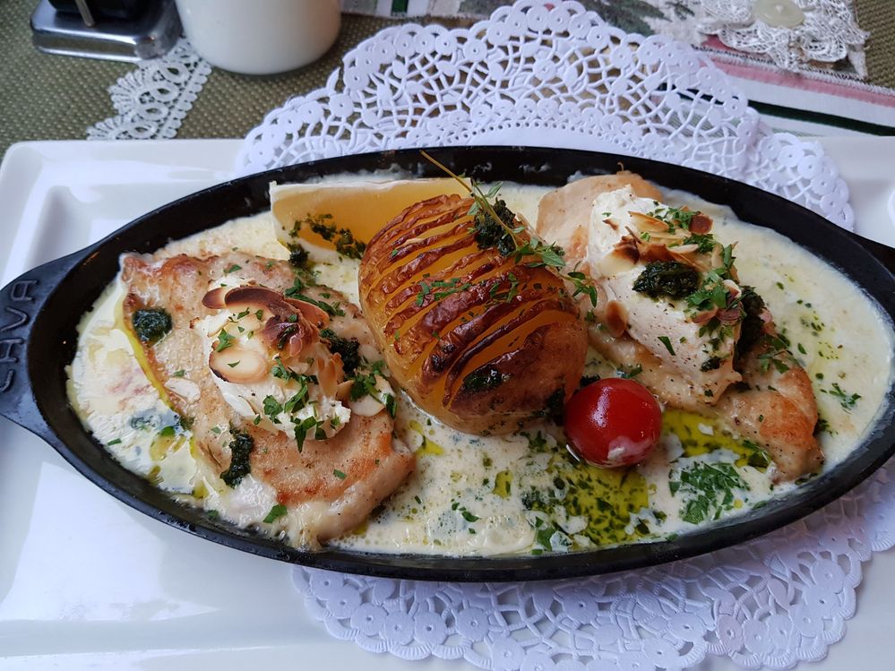Caption: A photo of baked chicken fillet with potato and lemon butter sauce (Local Guide Aaron Marsh)