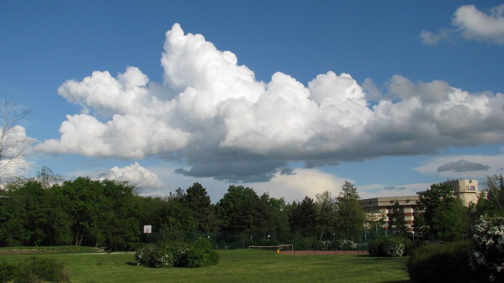 Caption: A photo of clouds in Hisarya, Bulgaria with blue sky and green trees visible (Local Guide @KatyaL)