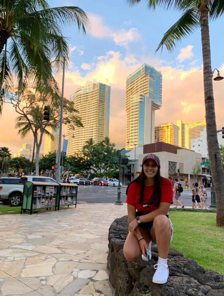 My daughter Chrystal posing for me in front of a beautiful sunset in Waikiki Hawaii.
