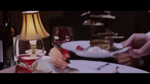 A GIF from the movie The Departed  where they are presented with french desserts