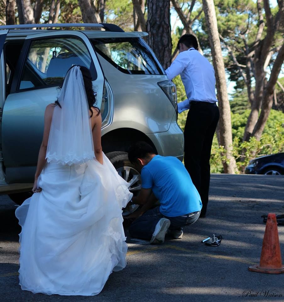 And always be on the look out for unexpected scenes like this one. The  Bride and Grooms were doing a photography session , and when trying to go back to the guests ,  A  flat tire. The Photographer and with the groom giving him instructions  was changing the tire, The bride was cursing and swearing , very unlady like under her breath,