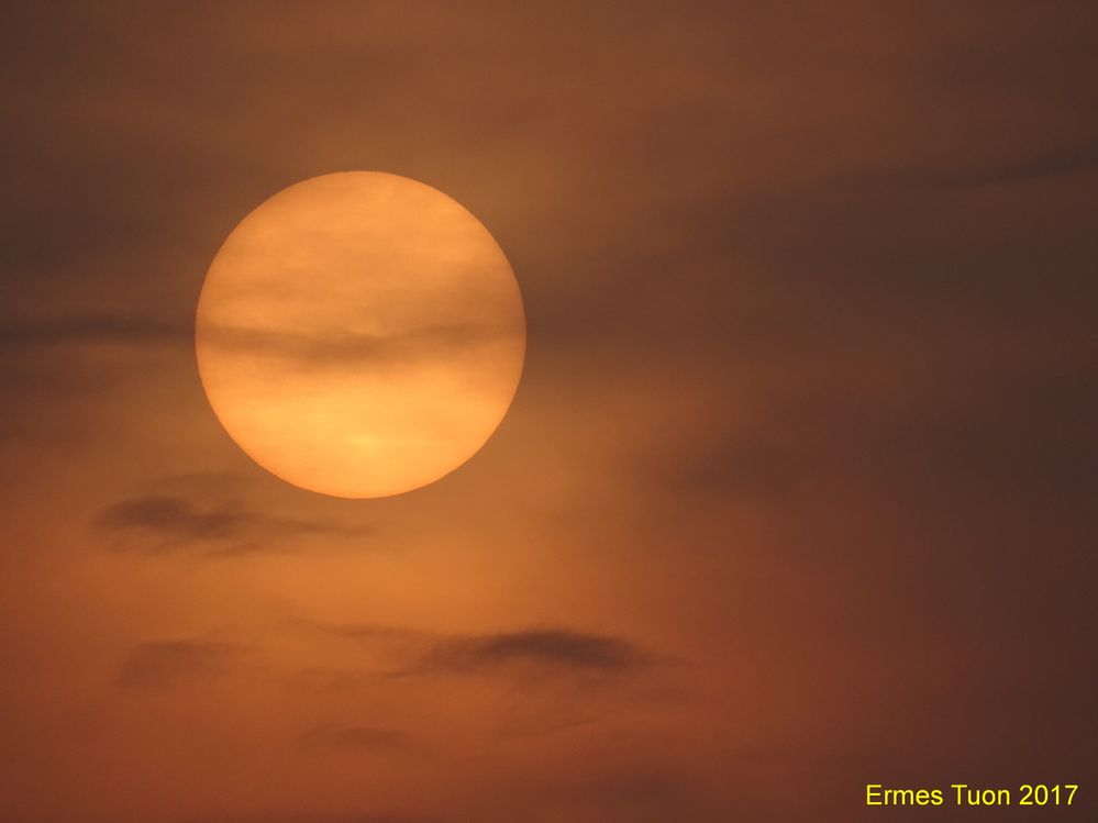 Caption: A view of the sun through the fog, minutes before the sunset - Local Guide @ermest