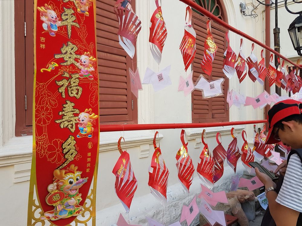 [Photo above] Handmade decorations from red packets