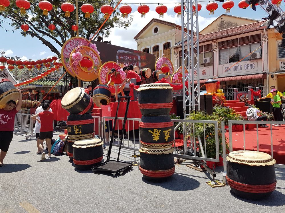 [Photo above] Big drums and decorations in the street in Penang