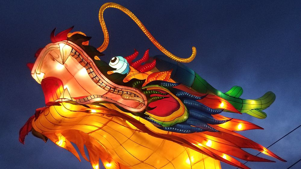 Caption: A close-up photo of a lit lantern in the design of a Chinese dragon taken during Lunar New Year at night. (Local Guide Bobbie West)