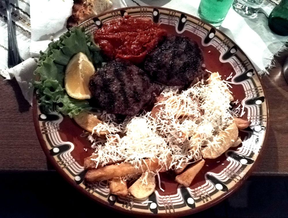 Caption: A photo of a traditional Bulgarian dish - meatballs, french fries and traditional Bulgarian ljutenica (a mixture of tomatoes, peppers, carrots and herbs). (Local Guide @TsekoV)
