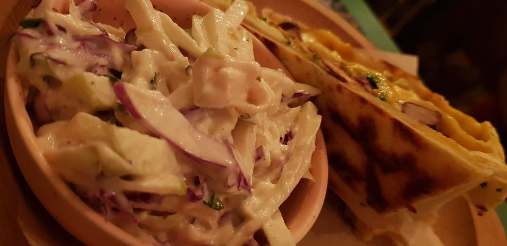 Caption: A close-up photo of a plate of coleslaw and vegetarian quesadilla - Made in Home, Sofia, Bulgaria (Local Guide @Petra_M)