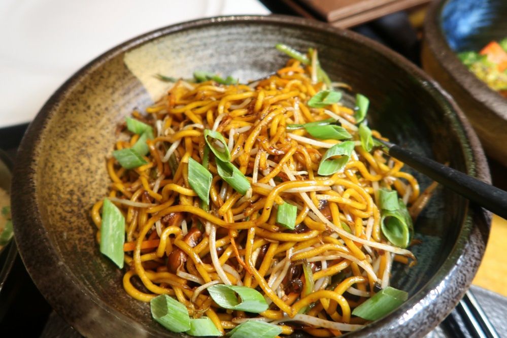 Caption: A photo of a bowl of noodles with chopped scallions from Bā Restaurant & Lounge, a Chinese restaurant in Dubai. (Local Guide Courtney Brandt)