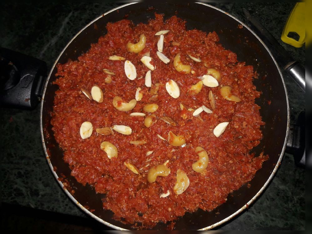 Caption: Gaajar ka halwa placed in a black container (Photo by Local Guide IshantHP_ig).