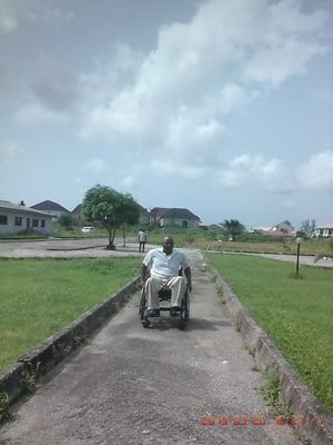 Caption: wheelchair ride along a wheelchair accessible walkway. #AccessibilityIsFreedom.