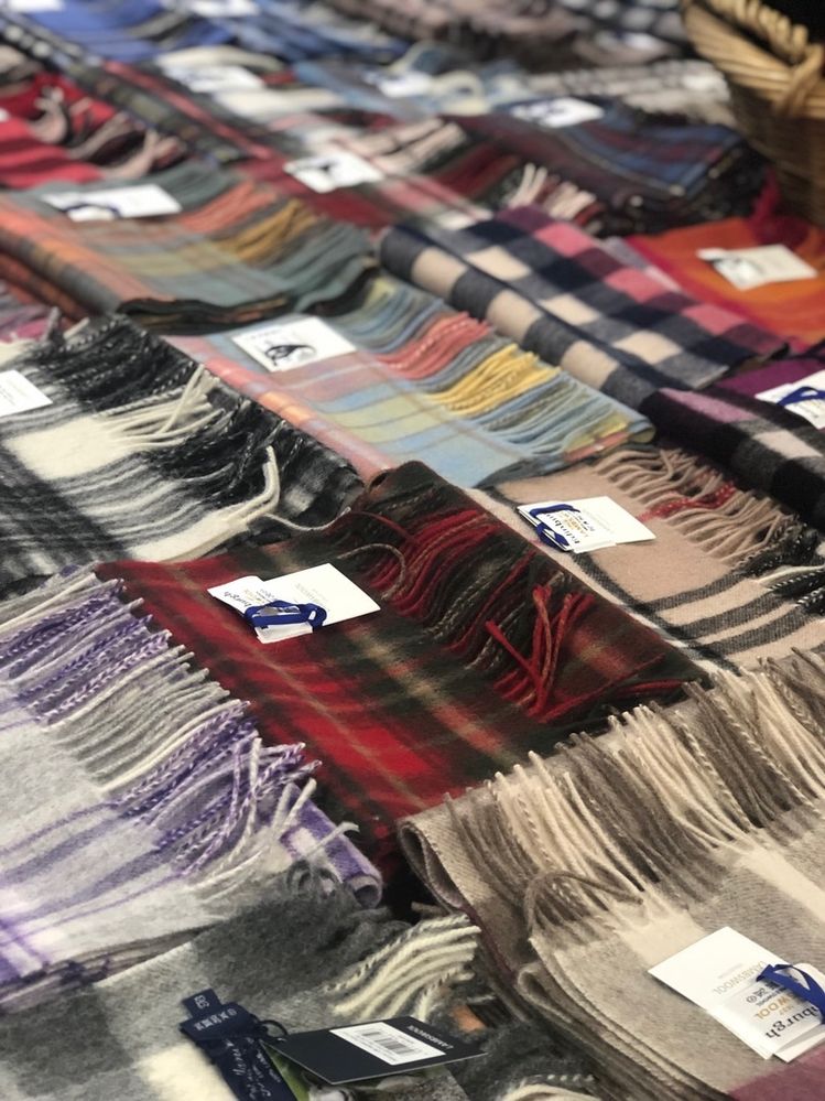 A cocophony a wildly different tarrtan patterns in woolen scarves on sale in Edinburgh. Note that the photo might make you feel uneasy, since your eye doesn't know where to look. Clearly, there is no organization to the display. Edinburgn, Scotland.