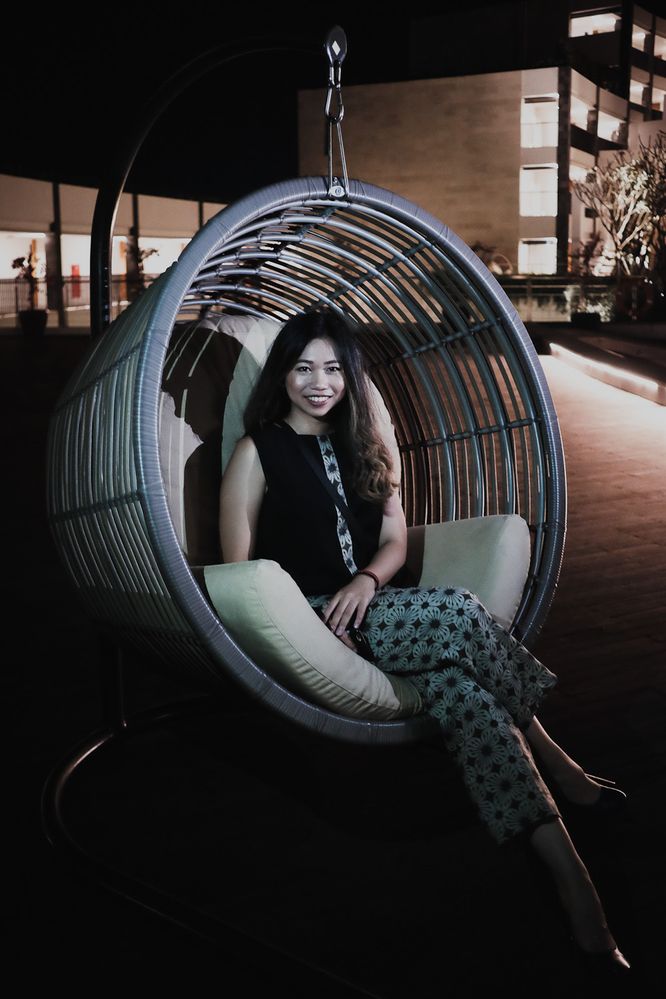Caption: A photo of Google Moderator @AngieYC sitting on a Swing Chair in Indonesian Batik Clothing. (Local Guide @AngieYC)