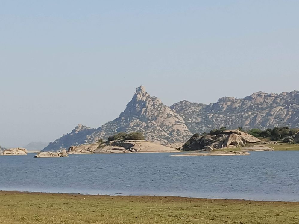 Jawai lake surrounded by rugged rocky mountains