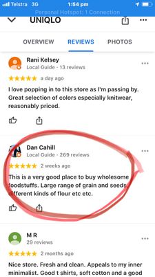 An iPhone screenshot showing three reviews for Uniqlo Perth, with the second review circled in red which contains a review for a different (food) business (not Uniqlo fashion store).