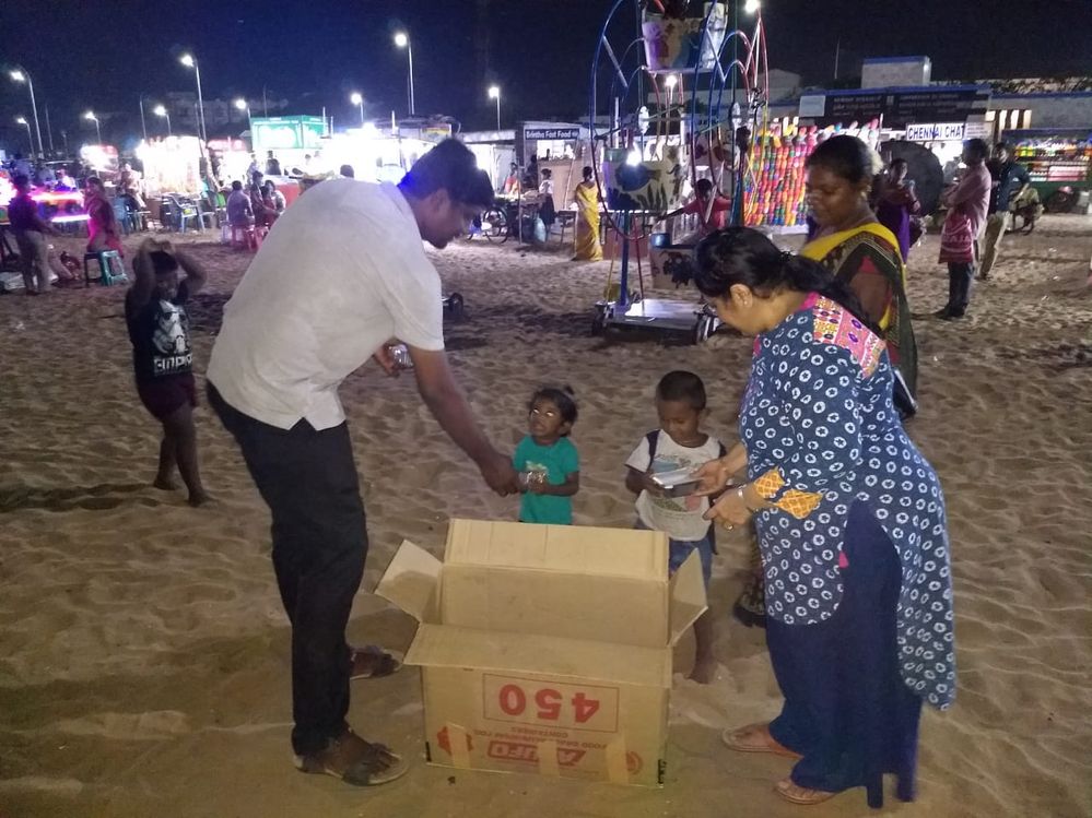 Myself and team members distributing fried rice to the cute kids at Chennai Marina Beach