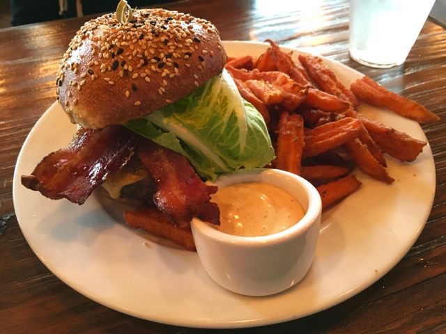 My wife's American burger with her share of sweet potato fries.