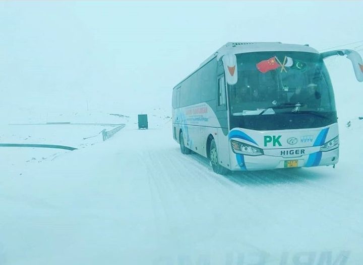 The first CPEC bus on its way (Lahore to Kashgar) at snowy Khunjerab Pass.