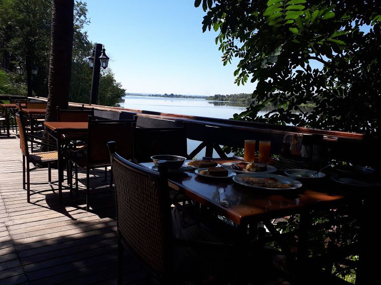 Picture: Breakfast at the Victoria falls waterfront along the  banks of the Zambezi river that cuts through 6 african countries enroute to the indian ocean