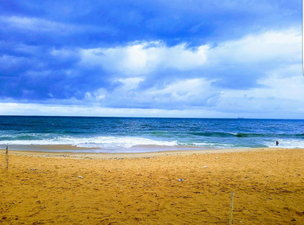 Caption: Blue Ocean, sand and cloud as it drizzled at Elegushi Beach in Lagos