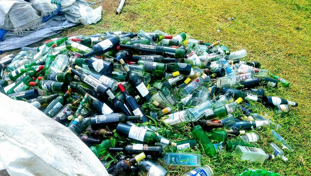 Caption: bottles picked from the shoreline awaiting storage and removal by recyclers