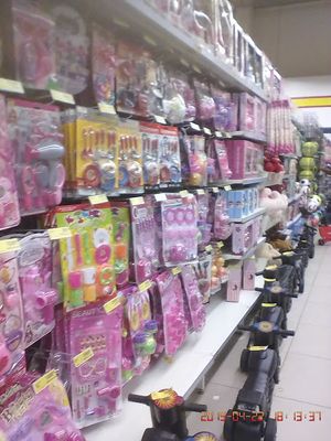 caption: Photo of another section of the shopping mall fully stocked with children's toys