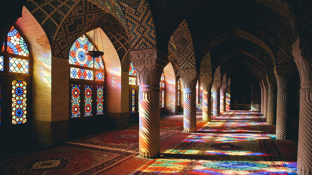 Caption: A photo of the stained glass windows and interior of Nasirolmolk Mosque in Shiraz, Iran. (Local Guide O.I.B. de Rijcke)