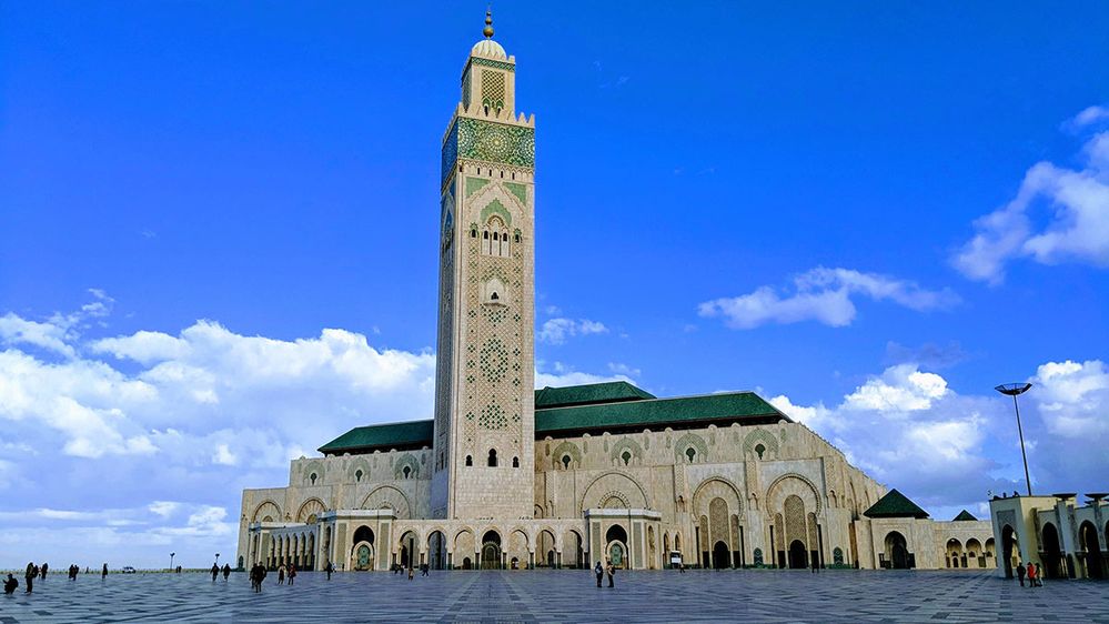 Caption: A photo of the exterior of Hassan II Mosque, in Casablance, Morocco. (Local Guide Is Song)