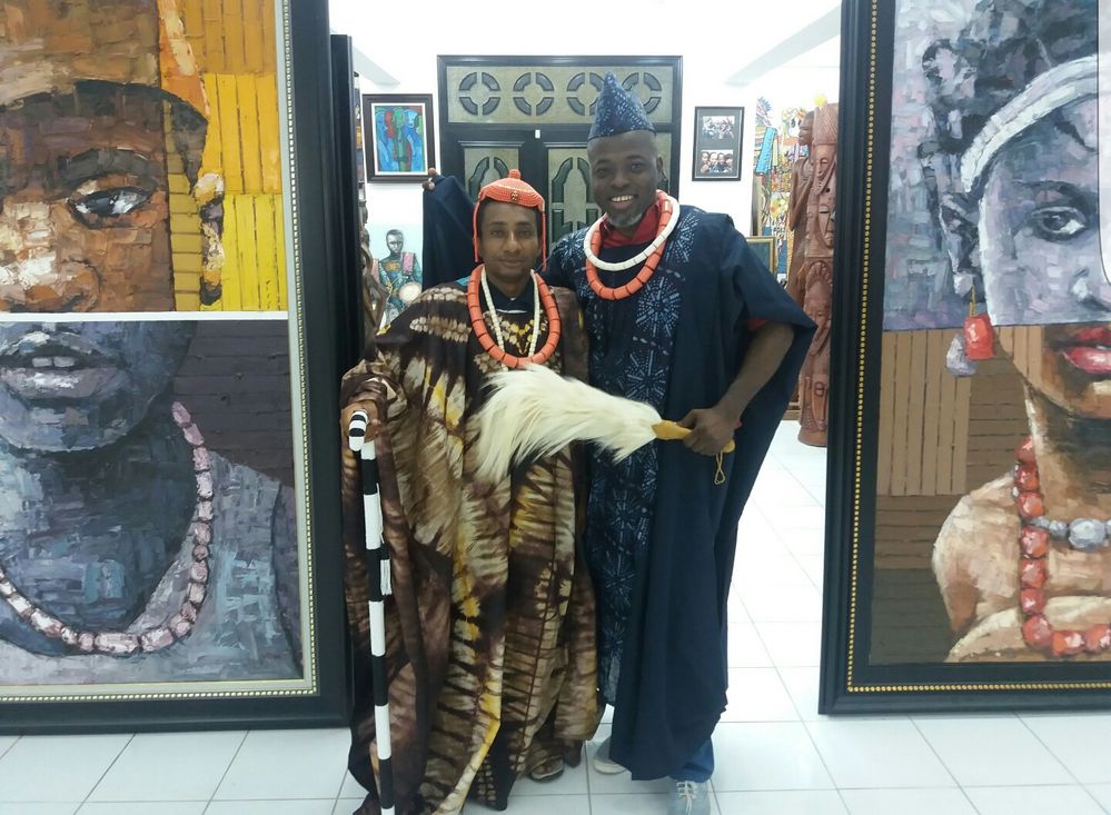 caption: Local Guides Emeka and Sanya dress in tradional Nigerian regalia during a meetup in Lagos