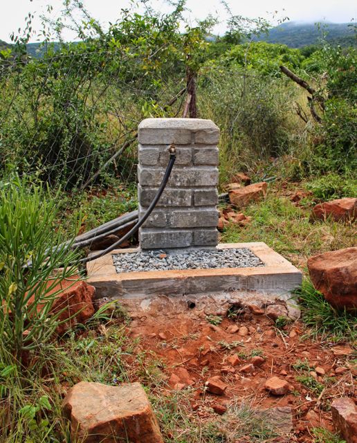 A photo of one of the tap systems that have been built by the people and placed through the common areas of the village. Photo credit: Local Guide Leora Hart