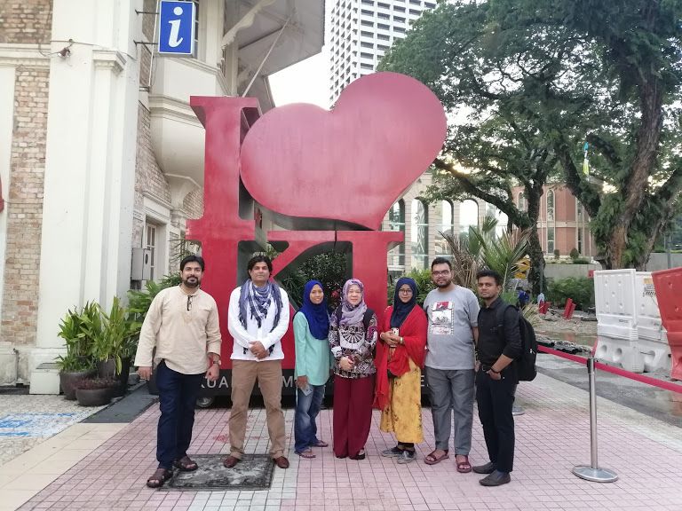 A few members of Malaysia local guides in front of I lOVE KL logo