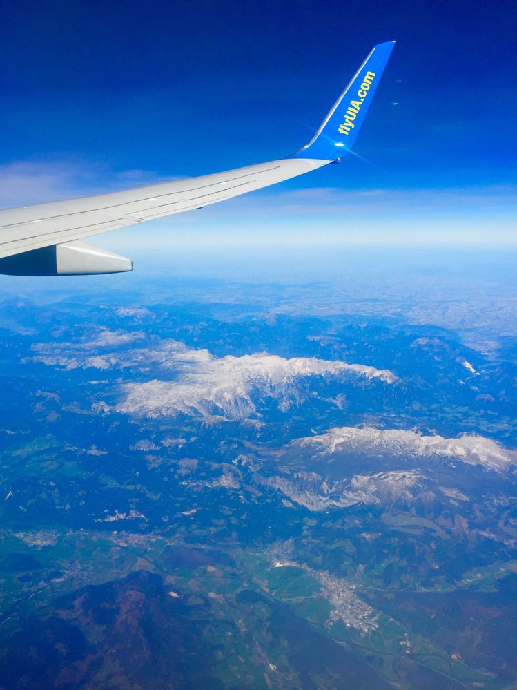 Caption: View from the airplane on the flight Kiev - Milan, passing Swiss mountains (Local Guide @uavalentine)