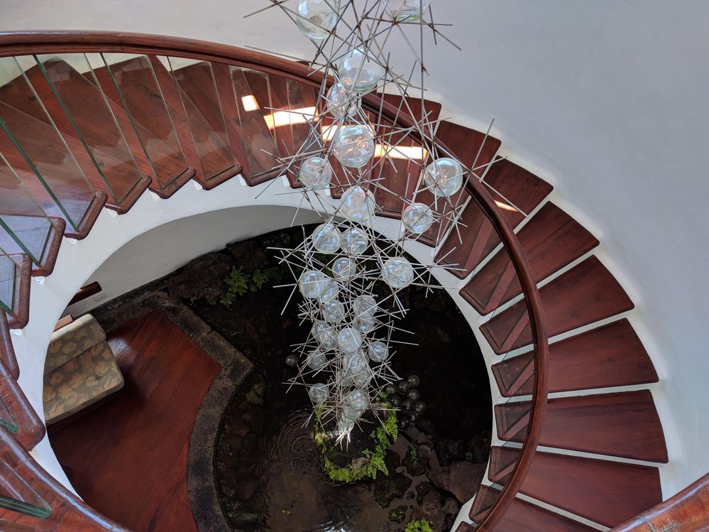 Caption: A photo of reddish brown staircase and an interesting art installation in the middle, Cactus Garden, Lanzarote, Spain (Local Guide @MoniDi)