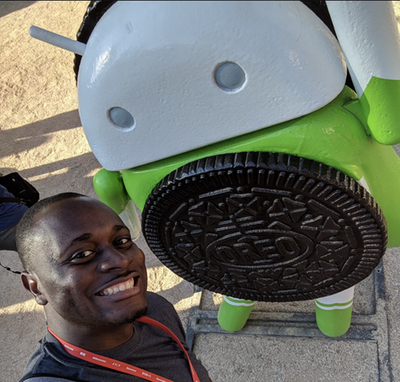 Caption: A photo of Steve with an Android Oreo statue.
