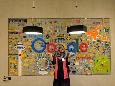 Caption: A photo of Sumaiya in front of a Google board.