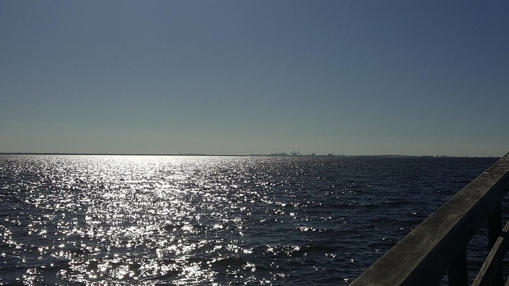 View from the Safety Harbor pier looking at to a lesser extend on the left side Mobbly Bay, but mainly to the middle and right the top of Old Tampa Bay.  The city of Tampa can be seen across the water.