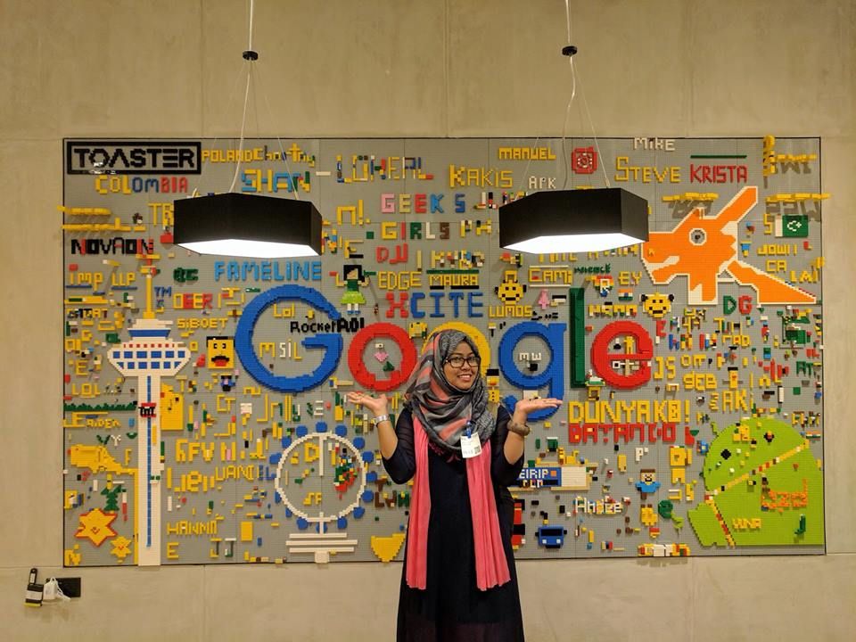 Caption: A photo of Sumaiya posing in front of a Google sign with her hands up. (Courtesy of Local Guide @SumaiyaZafrinC)